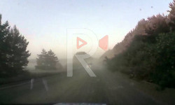 Сапырылган чаңдуу жолдон түйшүк тарткан эл