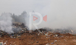 Талас: шаарды каптаган түтүн