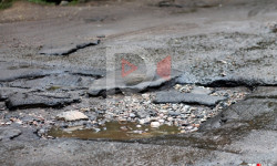 Талас: суу түтүктөрү киргизилип, асфальт жол талкаланды